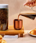 Renewed 6 Oz Smart Heated Coffee Mug With App Precision Temp Control And Solid Battery Life Keeps Your Favorite Brew Piping Hot And Ready For All Day Sipping Sessions, filled with coffee.