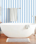 Easy Peasy Peel And Stick Self Adhesive Wallpaper With Chill Blue And White Hand Drawn Stripes in a bathroom setting.