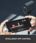 Mevo Start Wireless Streaming Cam With Legit 1080P HD Clarity shown with phone app for live video control.