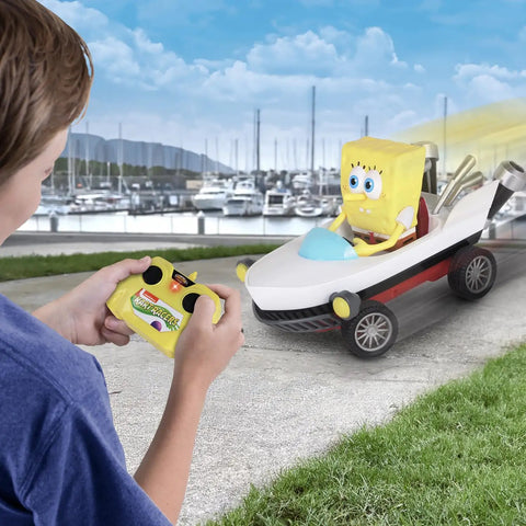 Child playing with SpongeBob Boatmobile RC Kart Racer 2.4GHz, Full Function Remote Control Vehicle With Grippy Tires For Maximum Traction
