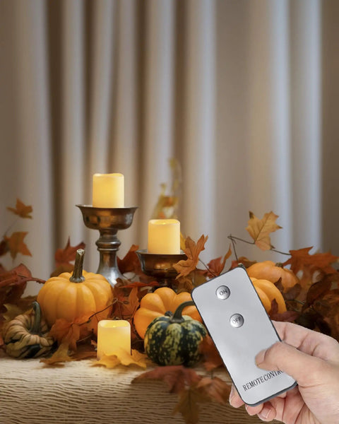 Remote Control Flameless Votive Candles 12 Pack Flickering Battery Operated LED Tealight Candles For Cozy Wedding And Christmas Decor Amber Yellow Batteries Included shown with remote in autumn decor.