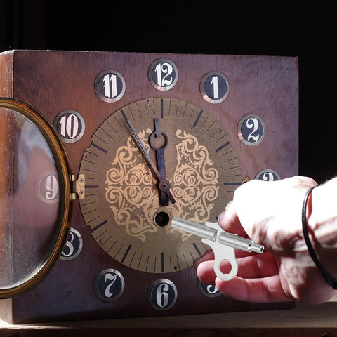 Hand winding a vintage clock with Double Ended Clock Key Set, 3 Pcs Winding Keys for Mechanical Clocks, Steel Silver Tone