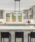 Industrial Farmhouse Island Light With Clear Glass Globe Shades 34 Inch Four Light Modern Linear Pendant Fixture in kitchen