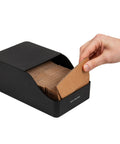 Hand accessing Hot Cup Sleeve Dispenser For Coffee Bar And Kitchen Organization, Grab And Go Space Saving Coffee Station Accessory