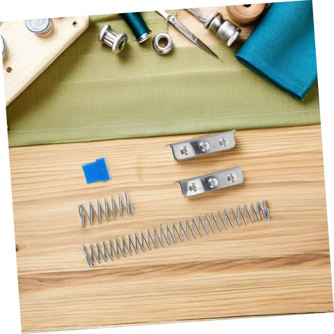 Fabric Cutter Flat Spring Holder For Cutting Machine Head Support, 5 Piece Set on wooden surface with sewing accessories