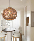 Seagrass Boho Chic Vibe Chandelier Hanging Lamp Natural Rattan Weaving Single Light Fixture in modern dining room setting.
