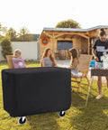 Waterproof Rolling Tool Cart Cover 36x18x33 Inch For 32x18 Mobile Utility Carts in a backyard setting with people relaxing.