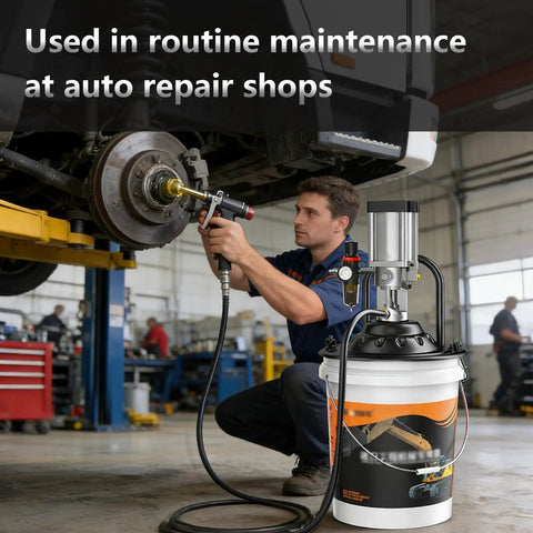 Mechanic using Heavy Duty Pneumatic Grease Pump For Industrial Lubrication with bucket-type gun and 19.6 ft hose in workshop