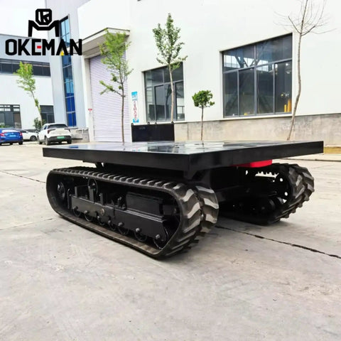 Heavy Duty Self Propelled Machinery Moving Dolly With Remote Control For Industrial Equipment Transport Workhorse Grade Skates Heavy Hauling Made Dead Simple Move Anything Today side view showing sturdy tracks and flat surface.