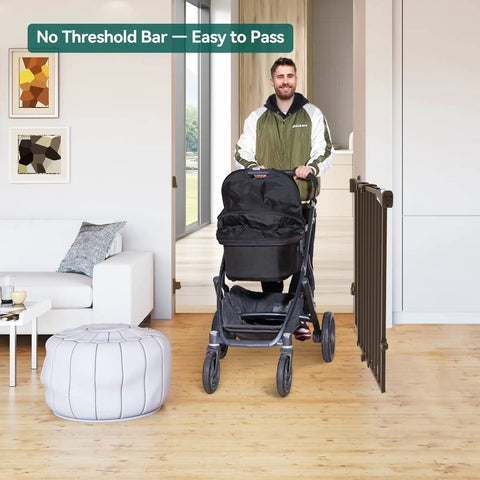 Man with stroller passing through Auto Close Baby and Dog Gate for Stairs and Hallways 2 In 1 Swing Doorway and Hallway Pet Gate Black