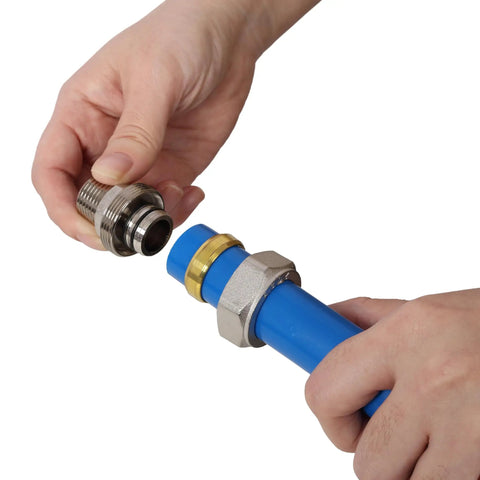 Hand connecting metal fitting to Boss Grade Blue Air Compressor Piping Tube 3/4 Inch X 200 Feet for leaks-free setup.