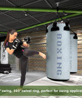 Heavy Duty 360 Degree Swivel Hanger Built Tough As Nails From Rustproof Stainless Steel Ceiling Bracket supporting punching bags in gym.