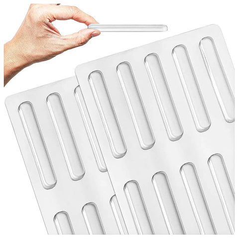 Heavy Duty Silicone Cabinet Door Bumpers, Ultra Grippy Self Adhesive Anticollision Tape, Pro Level Noise Dampening Pads for Kitchen Cabinets and Wood Furniture, showing hand holding clear silicone pad.