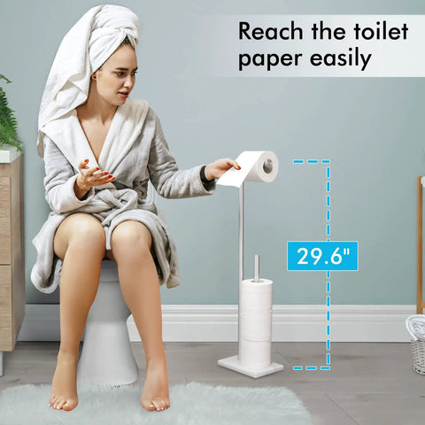 Tall Free Standing Toilet Paper Holder With Marble Base For Easy Reach No Bending Needed 29 And A Half Inch Bathroom Roll Stand In Brushed SUS304 Stainless Steel Elder Friendly Durable Modern Bath Accessory displayed beside a person reaching easily.