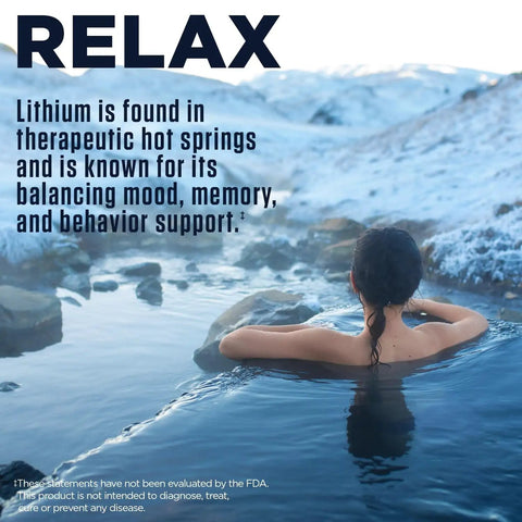 Person relaxing in a hot spring with text about lithium benefits for mood and memory support, mountains in the background.