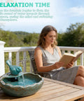 Solar Powered Bird Bath Fountain with Battery Backup for Outdoors on patio table, ceramic, 11.6 x 10 x 6.1 inches, woman reading nearby