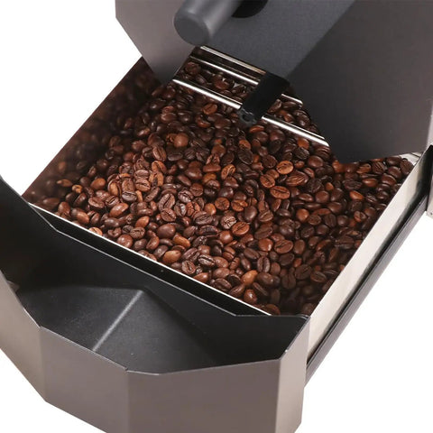 Kick Start Your Morning Vibe With This Electric Home Coffee Roaster featuring roasted coffee beans inside a compact roasting chamber.