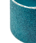 Close-up of Tough As Nails Zirconia Sanding Belts 2 X 36 Inch, showcasing abrasive texture for metal grinding and polishing.