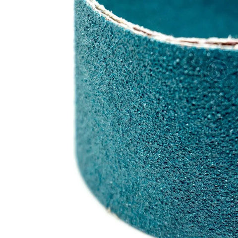 Close-up of Tough As Nails Zirconia Sanding Belts 2 X 36 Inch, showcasing abrasive texture for metal grinding and polishing.