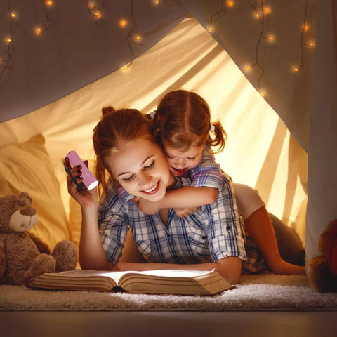 Mother and child reading with Pocket Size 9 LED Mini Flashlight Pack Six With Lanyards Multicolor Beams And 18 AAA Batteries Included