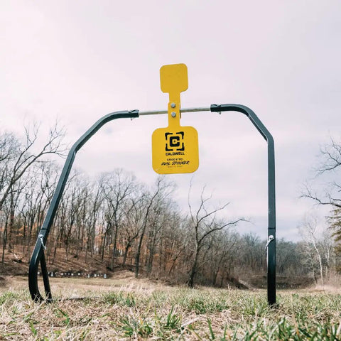 AR500 Dual Spinner Target For Rifle Shooting Three Eighths Inch Steel Target On A Collapsible Stand in an outdoor setting