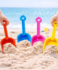 24 Pack Beach Shovels For Kids And Adults Heavy Duty Plastic Sand Toys Set Great For Sandcastles And Snow Play Outdoor Spade Scoop Trowel Accessories Bundle with colorful shovels in sand