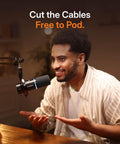 Person using Hybrid Wireless Podcast Microphone With USB And XLR For PC Mac Phone Tablet in home studio setup.