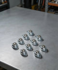 10 Pack Ball Wheel Casters Galvanized Carbon Steel Heavy Duty Roller Balls on a metal surface for workshop mobility.