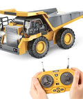 Remote Control Dump Truck Toy With Metal Bed And Lights And Sounds, Real Tilting Dump Bed shown with controller for boys aged 6 to 10
