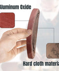 Hand holding 1/2 x 18 inch aluminum oxide sanding belt roll, highlighting material composition for woodworking use
