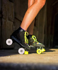 Flashing Roller Skate Wheels With Bearings For Quad Skates That Light Up And Look Lit For Indoor And Outdoor Skating Replacement Parts 2 Pack Built For Durability And Smooth Rolling, stylish neon laced black skates on concrete.
