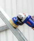 Tough As Nails 6 Pack 4 Inch Wire Cup Brushes For Angle Grinders With 5/8 Inch Arbor in use for rust removal on metal.