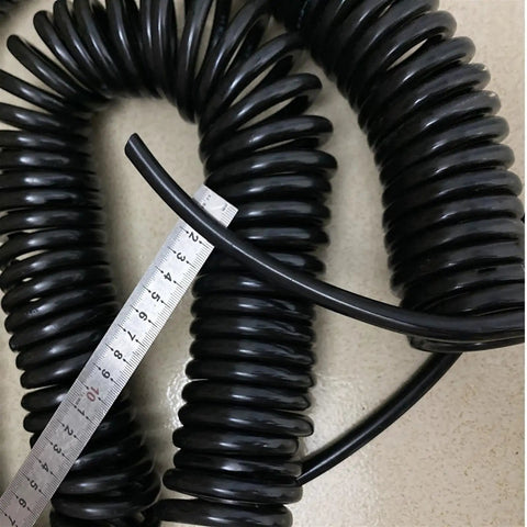 Heavy Duty Retractable Twin Spiral Extension Cord With Four 2.5 Mm Conductors Stretching Up To Ten Meters, coiled and measured.