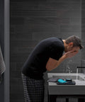 High Arc Matte Black Lavatory Faucet With 1 Or 3 Hole Install in modern bathroom with man washing face