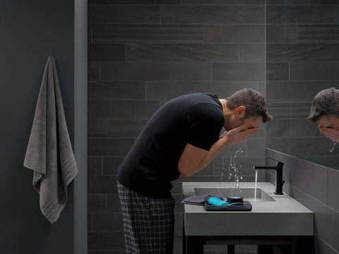 High Arc Matte Black Lavatory Faucet With 1 Or 3 Hole Install in modern bathroom with man washing face