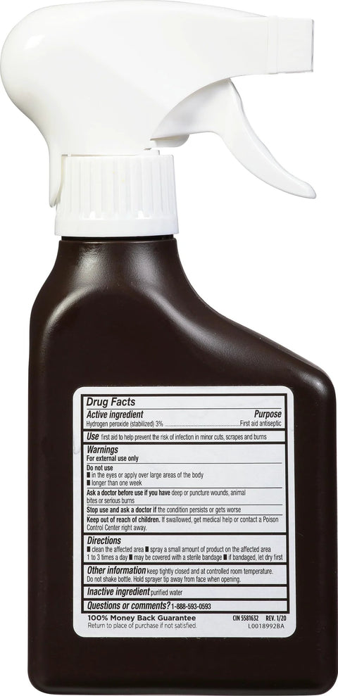Hydrogen peroxide spray bottle side view with white trigger sprayer on brown plastic bottle; label showing drug facts