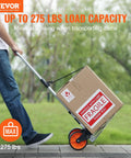 Man using Folding Hand Truck And Dolly For Easy Haul, 275 Lb Capacity Aluminum Cart With Telescoping Handle on pavement.