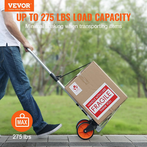 Man using Folding Hand Truck And Dolly For Easy Haul, 275 Lb Capacity Aluminum Cart With Telescoping Handle on pavement.