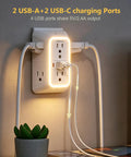 Straight Up Best Wide Spaced Wall Outlet Extender Includes Night Light Six AC Outlets Four USB Charging Ports And Functions As A Surge Protected Power Strip Doing Heavy Duty Plug Ins Daily with USB ports in use.