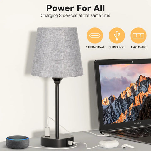 Set of Two Grey Bedside Lamps With USB C Port And AC Outlet 3 Way Dimmable Touch Control Nightstand Lamps shown charging devices