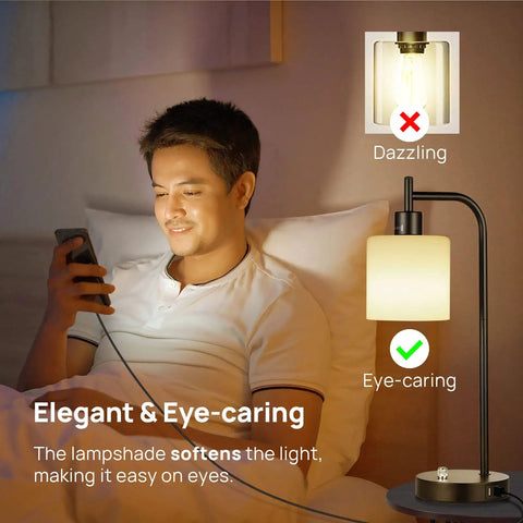 Man using phone with Dope Industrial Table Lamp Set Of 2 With Stepless Dimming USB Ports glass shade beside him on bed.