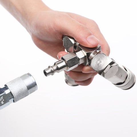 Close-up of hand holding 2-Way Air Hose Splitter Manifold with Quick Connect Fittings Two Universal Type Couplers and Industrial Type Plug