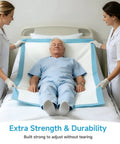 Two caregivers adjusting Top Shelf Super Absorbent Disposable Adult Bed Pads on a bed with a patient for protection.