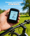 Hand holding GPS Cycling Computer With Wireless Ride Data, IPX7 Waterproof Bike Speedometer Odometer, 2.4 Inch LCD With Backlight