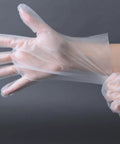 Person wearing Food Safe Stretch Poly Gloves Non Latex Disposable Powder Free For Food Handling Use Medium Size 1000 Count