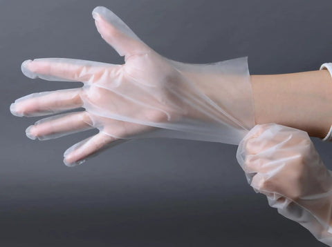 Person wearing Food Safe Stretch Poly Gloves Non Latex Disposable Powder Free For Food Handling Use Medium Size 1000 Count