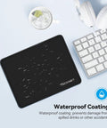 Ultra Smooth Gaming Mouse Pad With Dope Anti Fray Stitching Waterproof Surface And Non Slip Rubber Base Stitched Edges Works With Laser And Optical Mice Perfect For Laptop Setups shown on desk with clear glass and keyboard