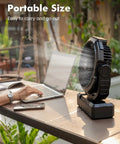 3 In 1 Camping Fan With 36000mAh Battery on table next to open laptop and smartphone, illustrating portability for outdoor use.