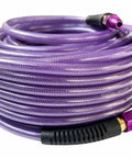 One Quarter Inch Polyurethane Air Hose Reinforced Lightweight Compressor Tubing Finish Safe And Slick Built Tough With Zero Drag For Auto Repair And Real Shop Grind Daily, coiled purple air hose with fittings.