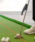 Dual Mode Indoor Golf Putting Trainer With Alignment Line, Red Line Practice Aid on home green with golf balls and putter
